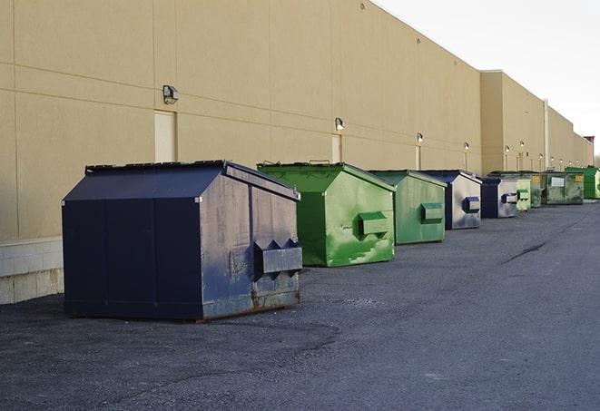 brightly colored dumpsters filled with construction waste in Cumberland Center ME